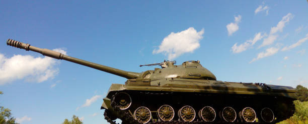 istock An outdated model of a Russian tank against a sky with clouds. 1393402523