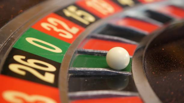 istock Ball on roulette table in casino. Wheel spinning, turning, rotating. Green zero. 1393404812