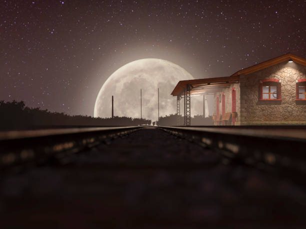 The railway track on a misty night with a full moon