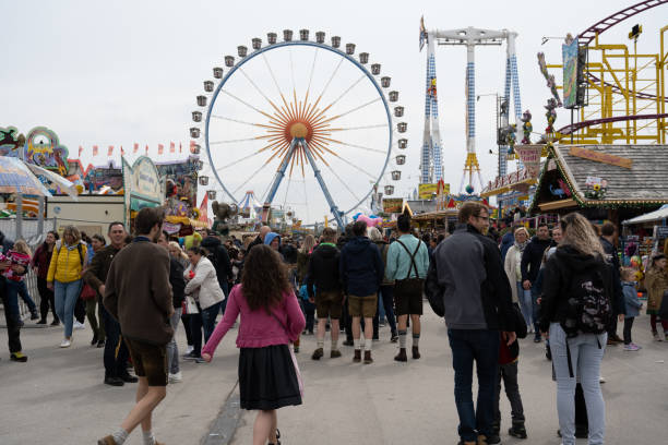 Munich, Germany - April 23, 2022: People at the Frühlingsfest (Spring Festival) on the Theresienwiese, the first festival since the beginning of the COVID-19 pandemic.