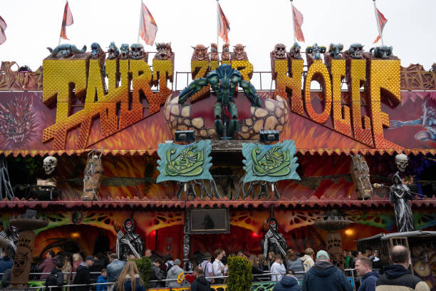 Munich, Germany - April 23, 2022: Fahrt zur Hölle (Ride to Hell) ghost train at the Frühlingsfest (Spring Festival) on the Theresienwiese, the first festival since the start of the COVID-19 pandemic.