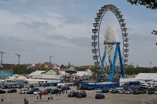 Munich, Germany - April 23, 2022: The Ferris wheel at the Frühlingsfest (Spring Festival) on the Theresienwiese, the first festival since the beginning of the COVID-19 pandemic.