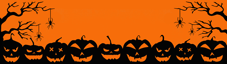 HALLOWEEN background banner wide panoramic panorama template -Silhouette of scary carved luminous cartoon pumpkins, trees and spiders isolated on dark orange night texture