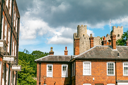 Rochester Castle behind a privately owned two-story house in Kent, England