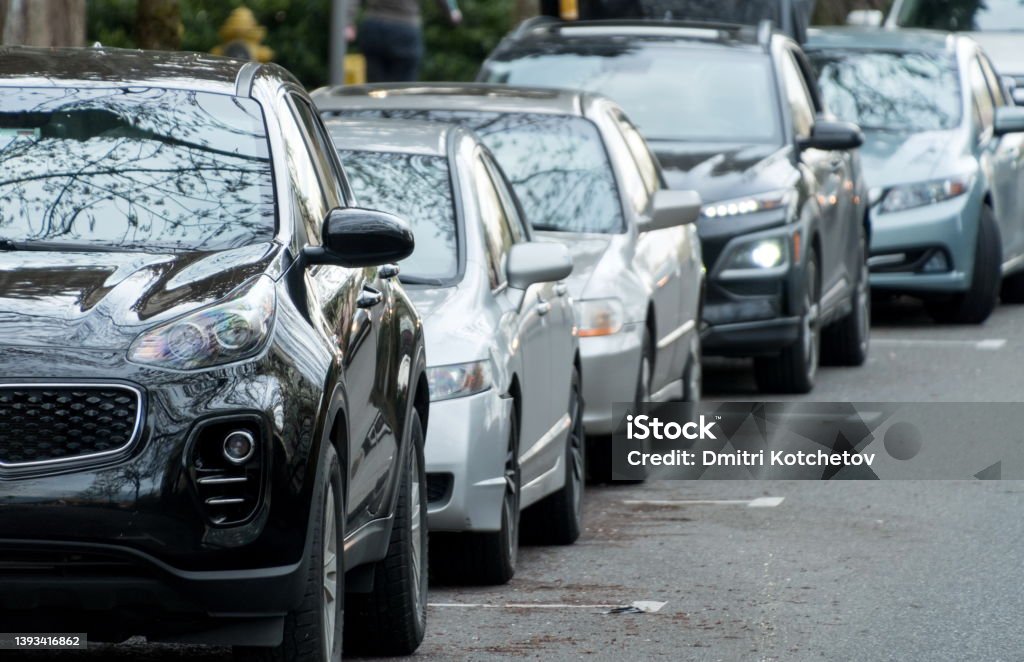 Long row of cars and SUVs parallelly parked near Redmond Town Center Long row of cars and SUVs parallelly parked near Redmond Town Center, Redmond, Washington Parallel Stock Photo