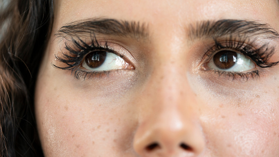 Macro photo of beautiful woman's eyes after spa treatment and eyelash extensions