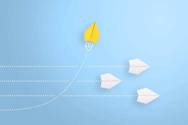 istock Change concepts with yellow paper airplane leading among white 1393420377