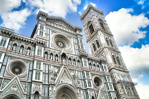 Piazza Santa Croce and the Santa Croce Cathedral filled with tourists in Florence, Italy.