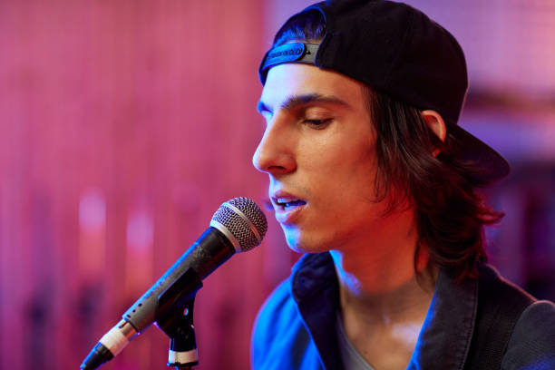 istock Young Male Singer Closeup 1393425409