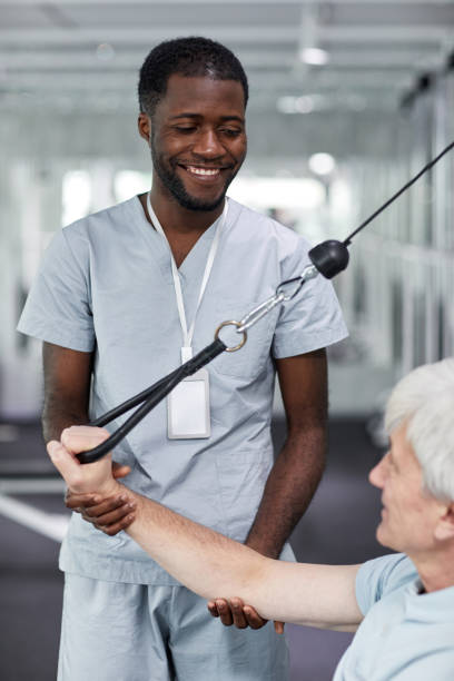 istock Rehabilitation Therapist with Senior Patient 1393428175
