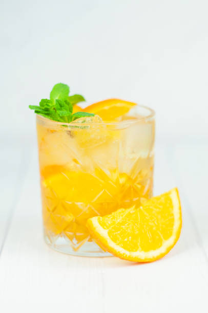 istock delicious refreshing cocktail drink with alcohol and orange with mint leaf 1393429689