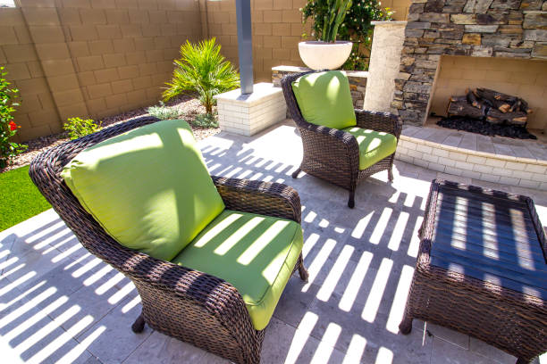 istock Wicker Patio Arm Chairs And Wood Top Table 1393431475