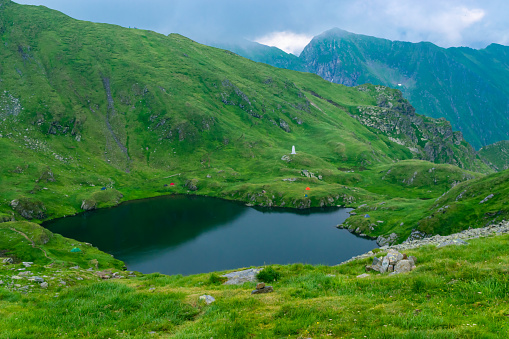 Capra Lake is glacier lake located in Fagaras Mountains near Transfagarasan mountains road, is one of the most beautiful roads in the world. Carpathians. Romania.