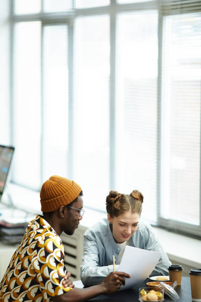 istock Two Young People in Office Minimal 1393432881