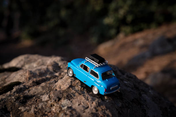 istock Miniature car travel with suitcases 1393434686