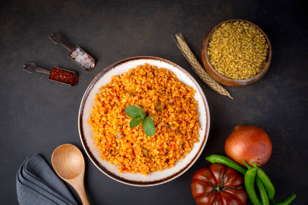 istock Traditional turkish bulgur pilaf with tomato sause in plate (Turkish name; meyhane pilavi) 1393437154