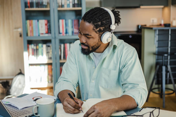 istock Young African-American man working at home 1393443028
