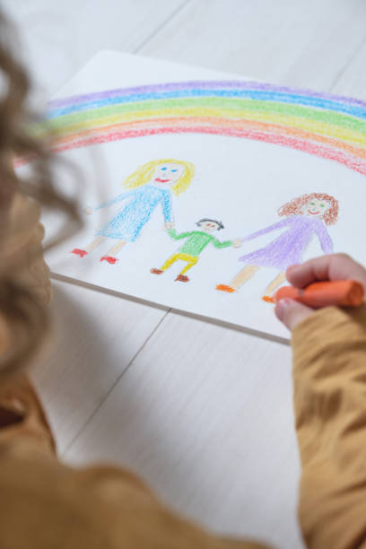 istock Crop kid drawing mothers and child 1393446285
