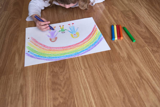 istock Crop child drawing on floor 1393446290