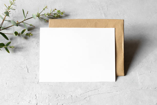 istock Wedding stationery invitation card mockup 5x7 on neutral grey background with envelope and eucalyptus 1393448507
