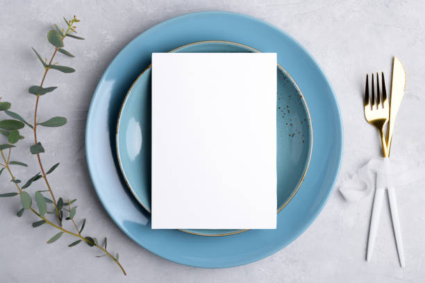 istock Wedding stationery invitation card mockup 5x7 on grey background with eucalyptus, Menu card mockup with table setting 1393448533