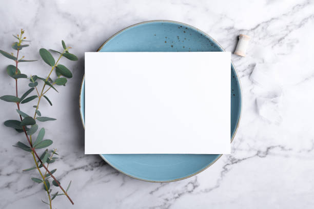 istock Wedding stationery invitation card mockup 5x7 on marble background with eucalyptus, Menu card mockup with table setting 1393448535