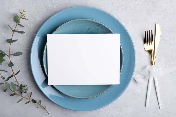 istock Wedding stationery invitation card mockup 7x5 on grey background with eucalyptus, Menu card mockup with table setting 1393448536