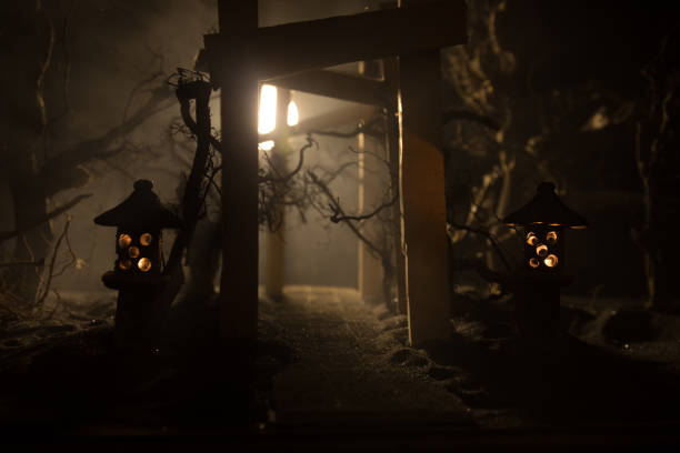 istock Creative artwork decoration. Abstract Japanese style wooden tunnel at night. Selective focus 1393460425