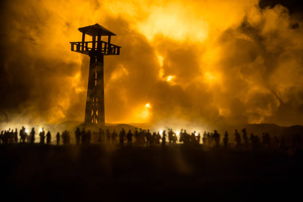 Creative artwork decoration - Russian war in Ukraine concept. Crowd looking on giant explosion and giant watchtower. Selective focus
