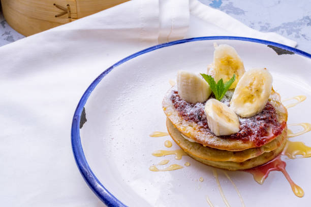 istock pancake with bananas and raspberry jam on plate 1393463651