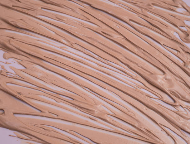 istock Makeup base cream blur, red clay mask texture. Background 1393465573