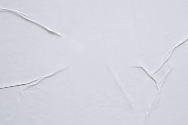 istock white crumpled and creased paper poster texture background 1393465712