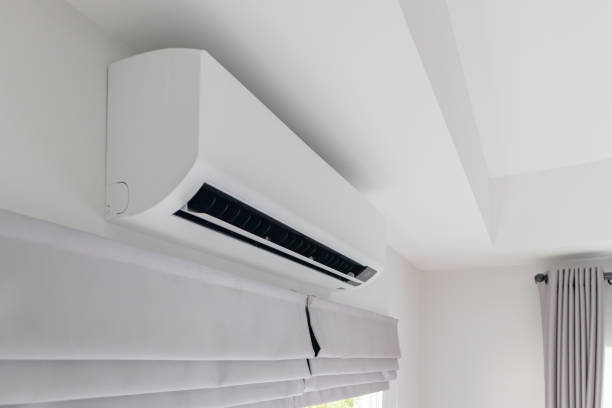 istock Air conditioner on white wall room interior background 1393465850