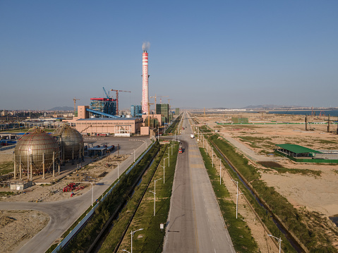 A main road leading to a large chemical plant