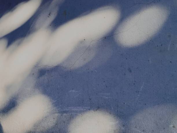 istock Blurred circle lights on grunge wall background. 1393473542