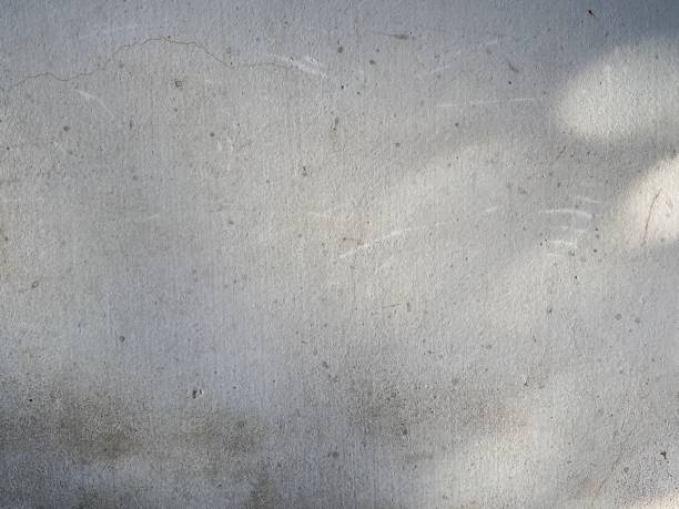 istock Blurred circle lights on grunge wall background. 1393473599