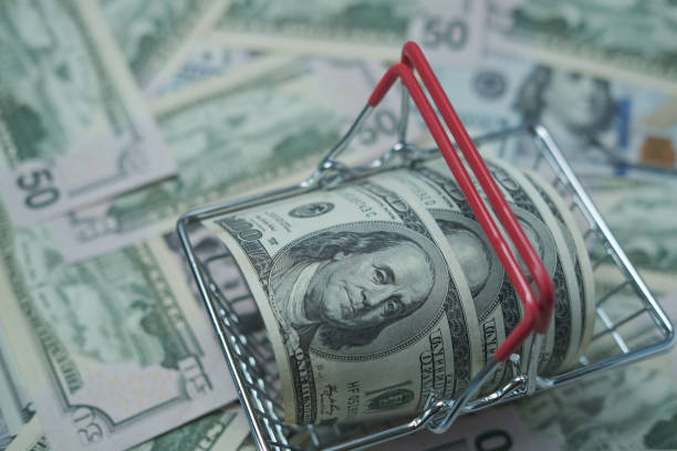 istock Dollars are in the grocery basket. 1393474456