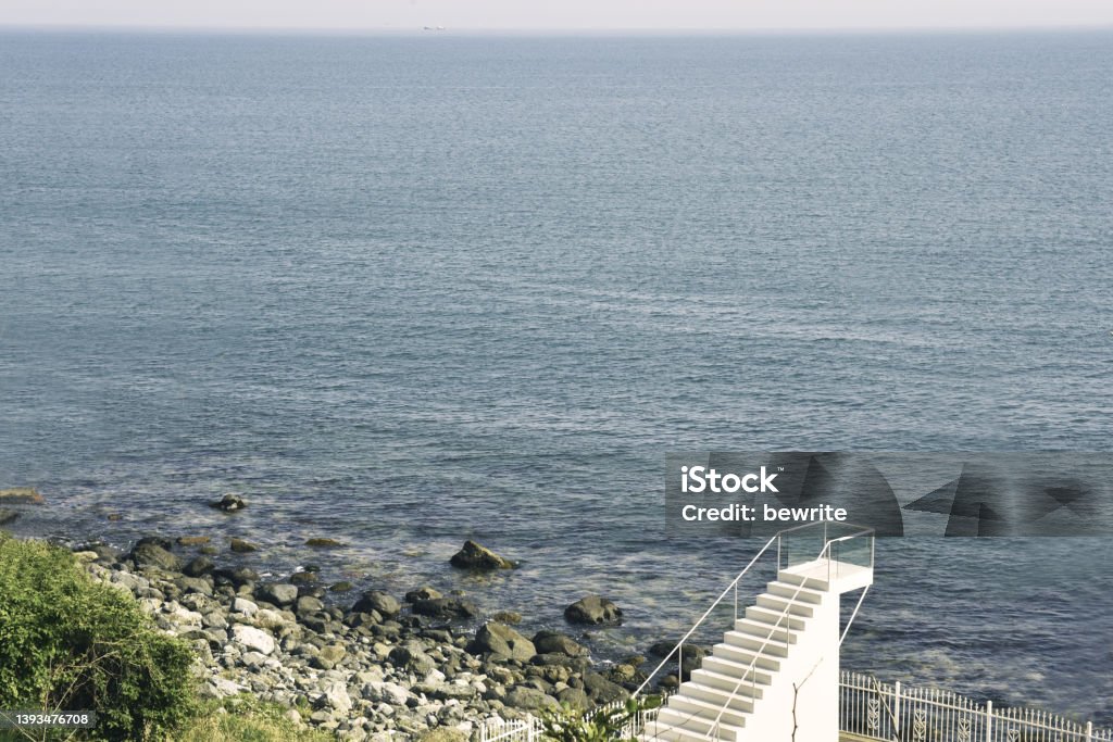 a flight of stairs to the sky on Mipo Beach Blue Stock Photo