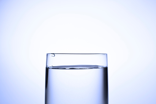 Extreme close-up of glass of water.