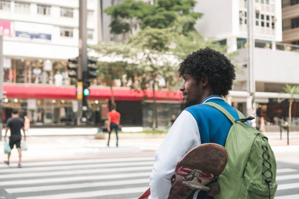 istock Skateboarder crossing the crosswalk 1393482000