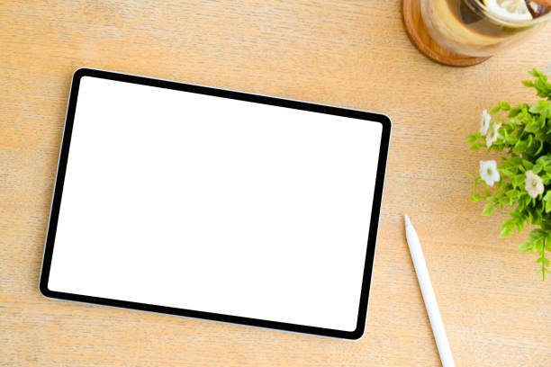 istock Top shot, A digital tablet touchpad mockup on wood table background. 1393484028