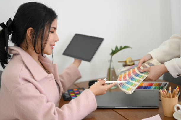 istock Female graphic design working at her office desk 1393484179