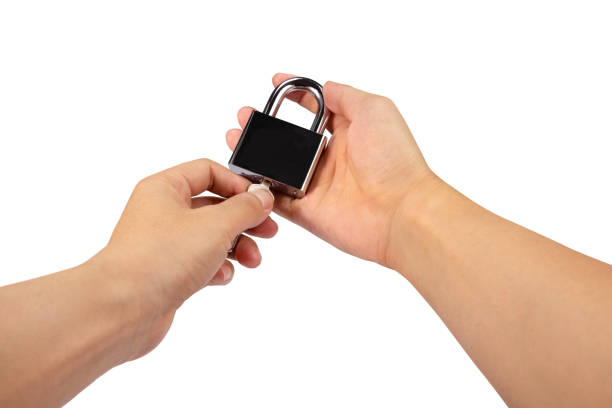 istock Hand holding a Bunch of keys with padlock isolated on white background. 1393485066