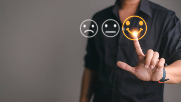istock Businessman pressing smiley face emoticon on virtual touch screen. Customer service evaluation concept. 1393485964