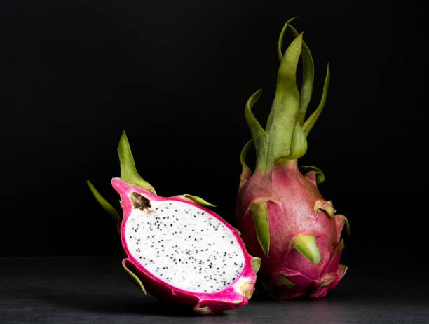 istock Dragon fruit, pitahaya on black background, side view, copy space. Tropical fruits. 1393486216