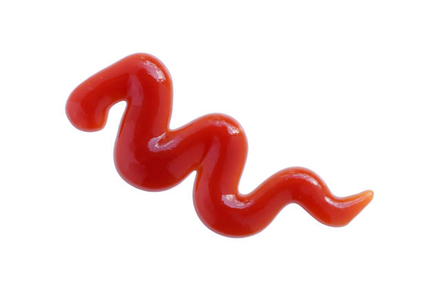 istock Red ketchup isolated on white background with clipping path. tomato sauce texture. from above. 1393488347