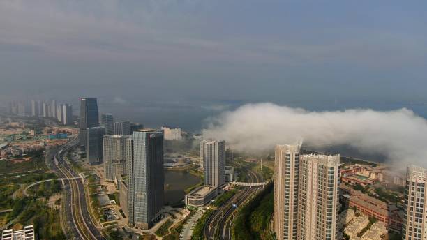 istock seaside city, clouds 1393489928