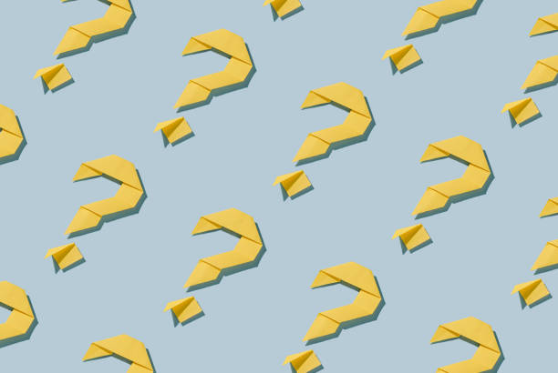 istock Background pattern of diagonal rows of origami question marks 1393489944