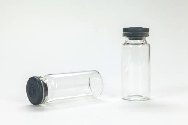 istock Glass bottle for vaccines on white background 1393494738