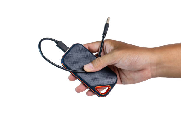 istock Black external hard drive handle with USB cable version 3 Faster backup, studio shots. Ready to continue working and have clipping path on isolated background 1393501692